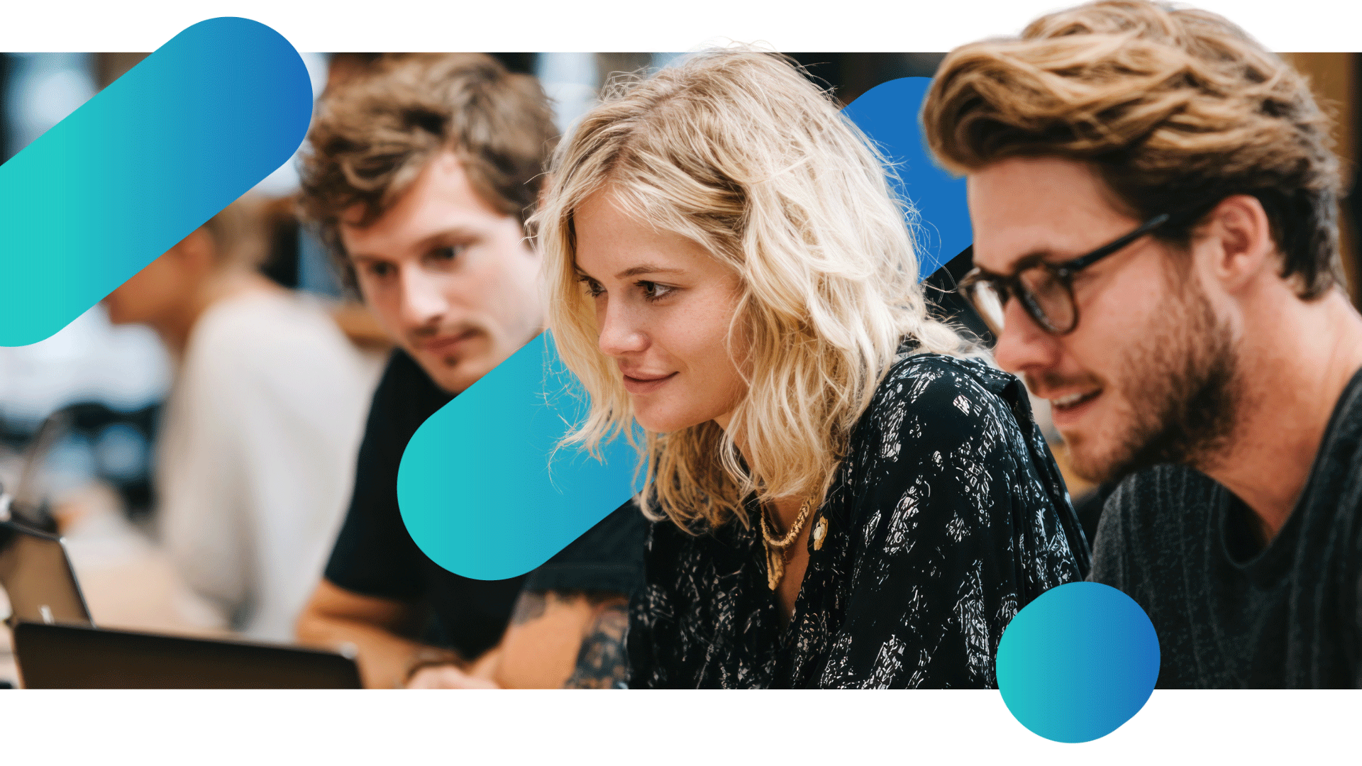 Fordway-Microsoft-Defender Three people at a desk in an office looking at a computer