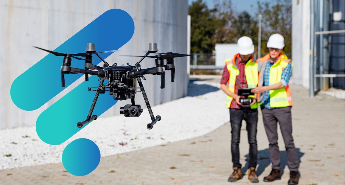 Fordway Drones two construction workers in yellow vests operating a drone